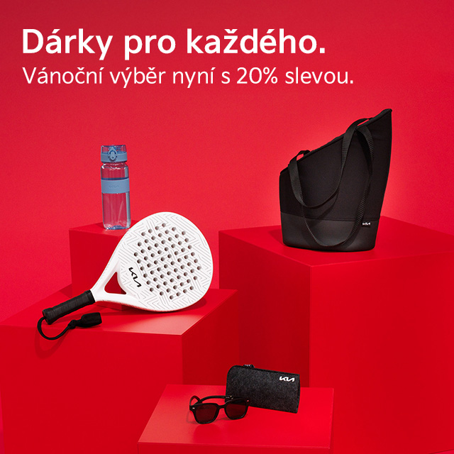 A Couple in Kia Softshell Jackets from the Kia Collection take cover under a Kia umbrella during a scenic mountain hike