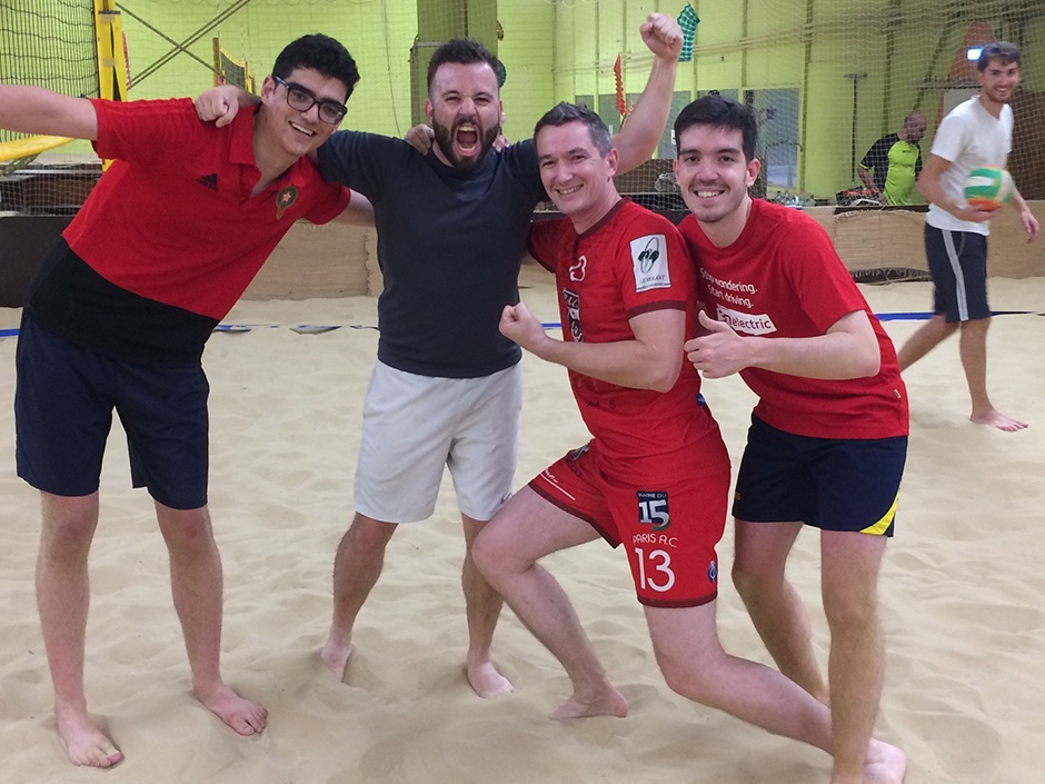 Young people on a volleyball field