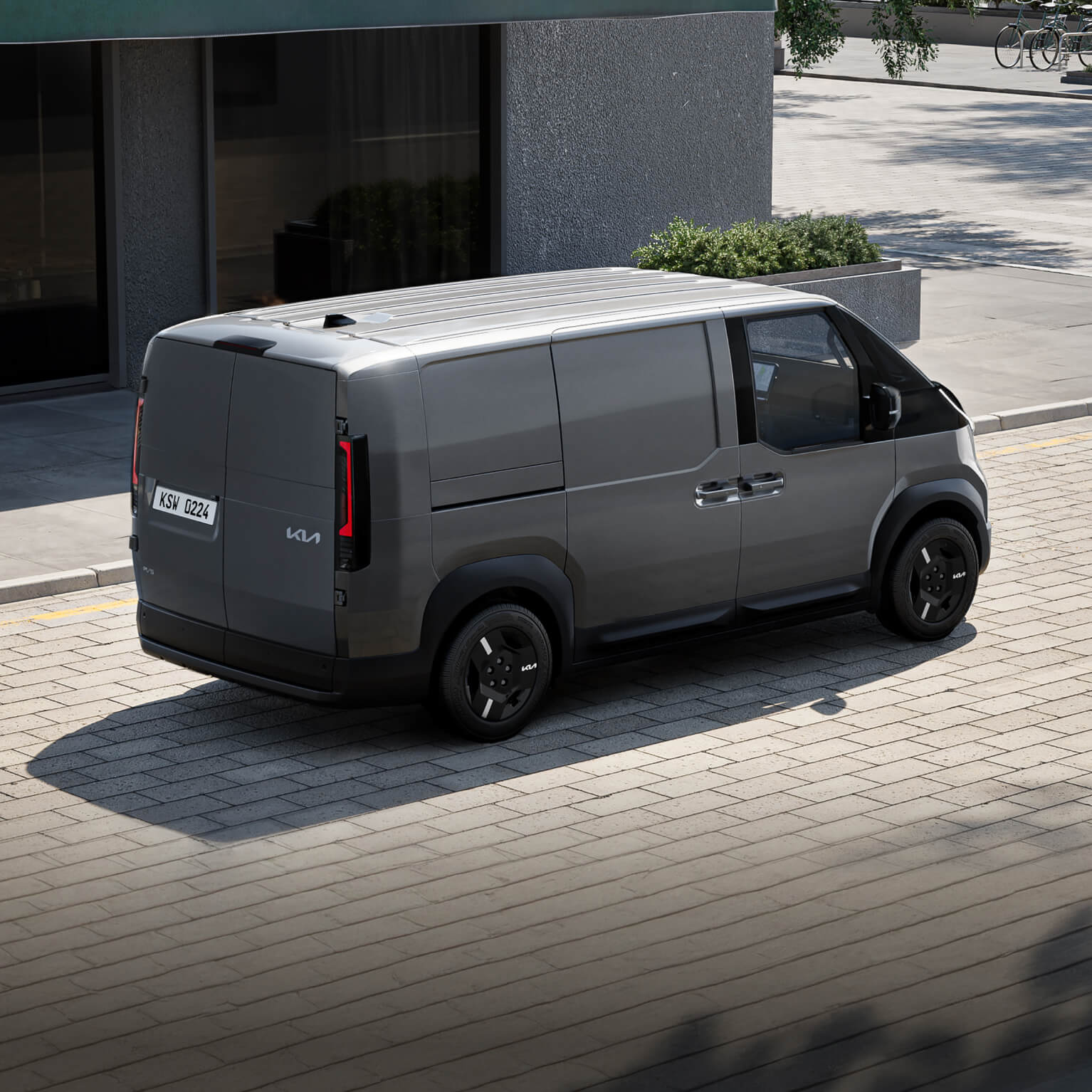Rear-side view of the Kia PV5 Cargo showcasing a space-efficient design with fast-access features and load-ready practicality