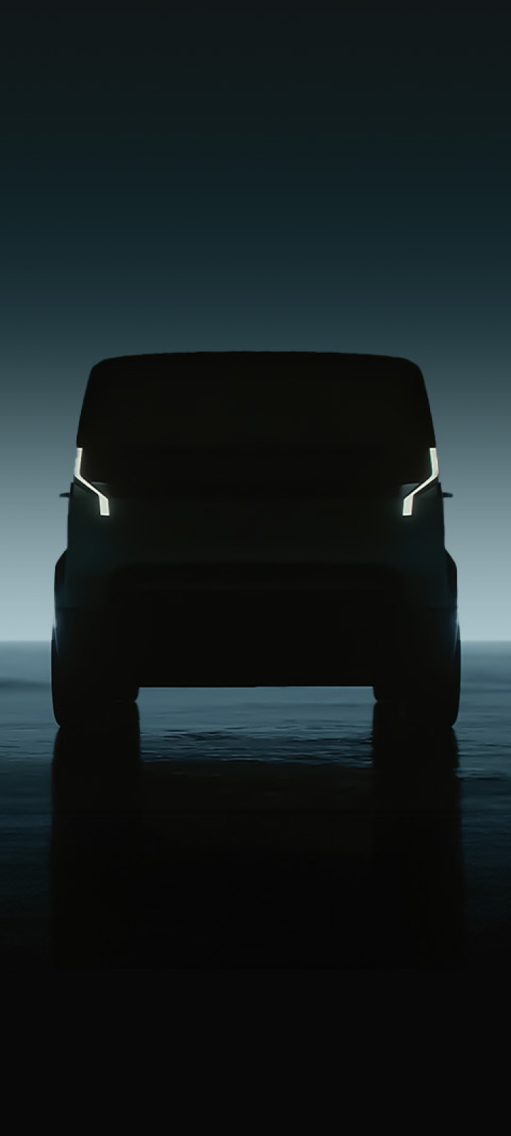 Frontal silhouette view of Kia PBV with illuminated signature lights against dark