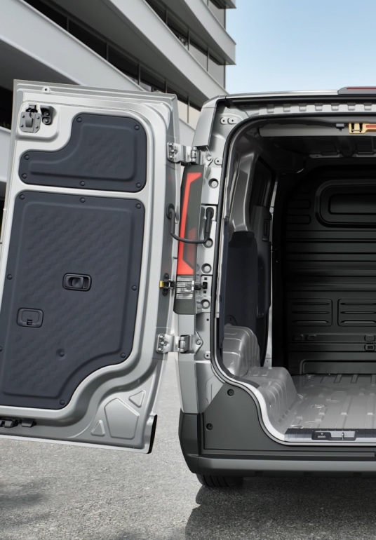 Wide-open rear doors of the Kia PV5 Cargo