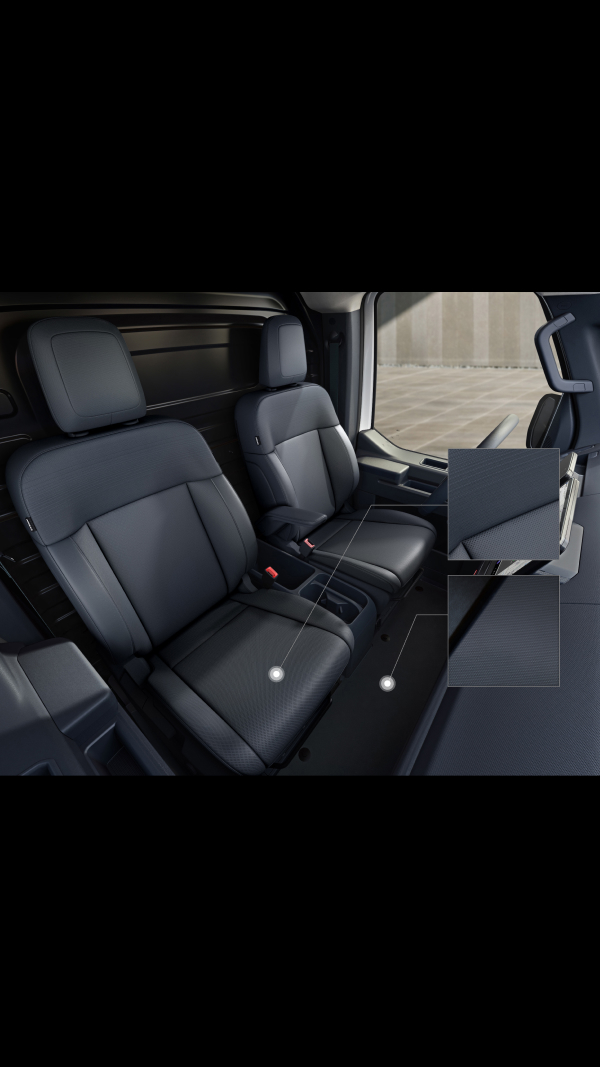 Kia PV5 Cargo front seats with close-up insets highlighting the perforated seat fabric