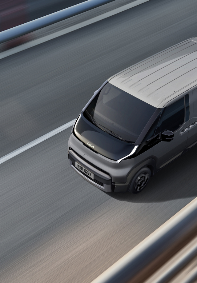 Top view of the Kia PV5 Cargo driving on a highway