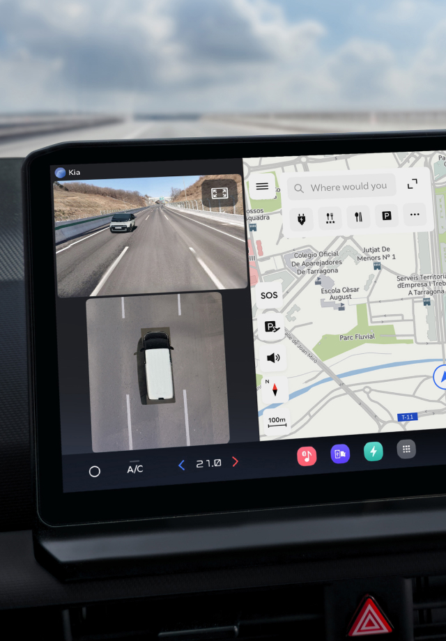 Close-up of the infotainment screen showing a navigation map and rear camera view