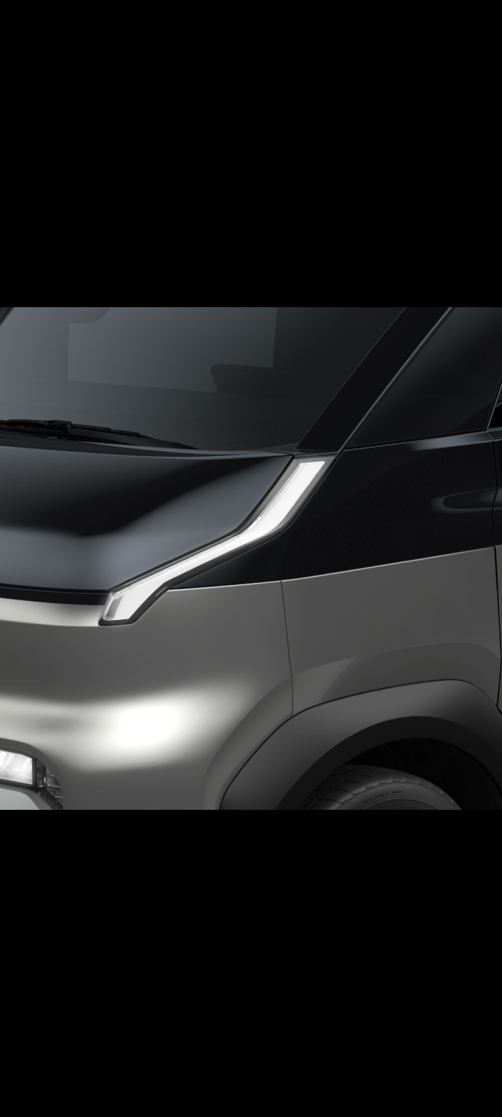 Close-up of the Kia PV5 Cargo front headlight and hood design