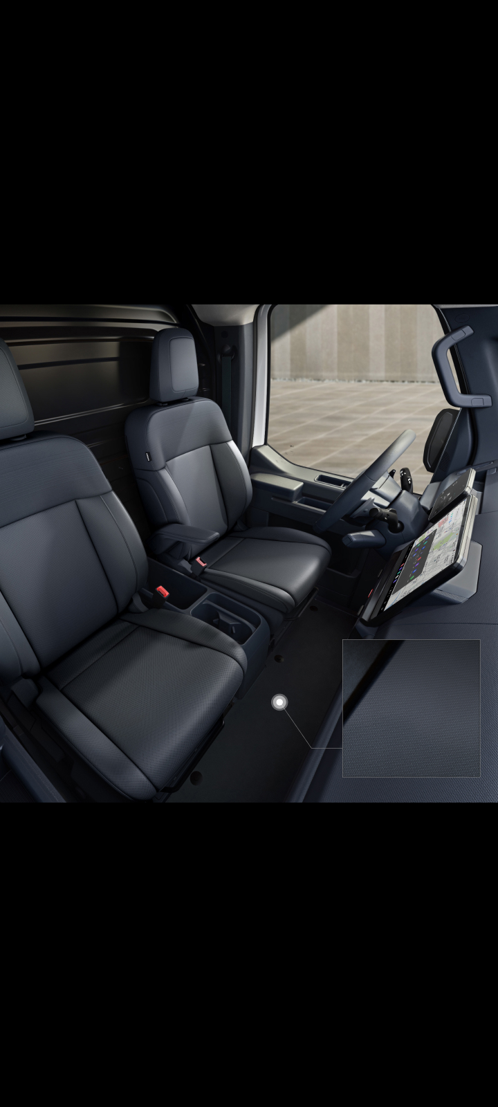 Close-up of the Kia PV5 Cargo interior floor with durable carpeting