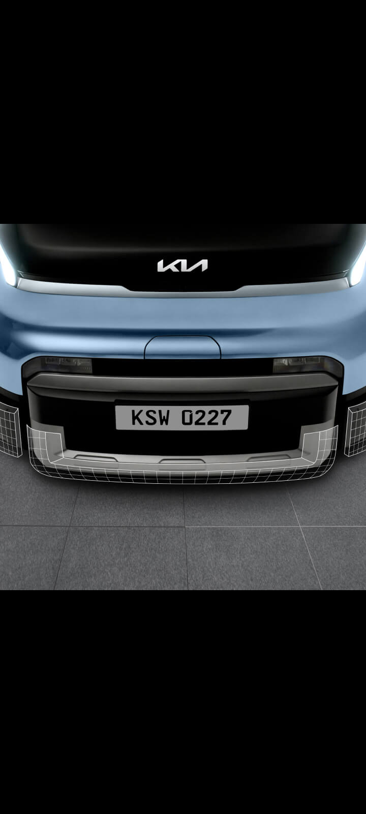 Front close-up of the Kia PV5 Passenger bumper showing three-piece repair structure