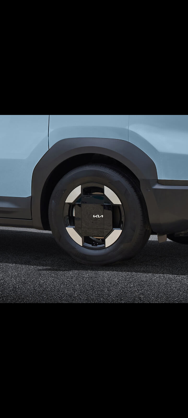 Side view of the Kia PV5 Passenger wheel arch with durable cladding design