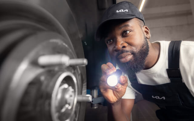 Mechanic working underneath a vehicle