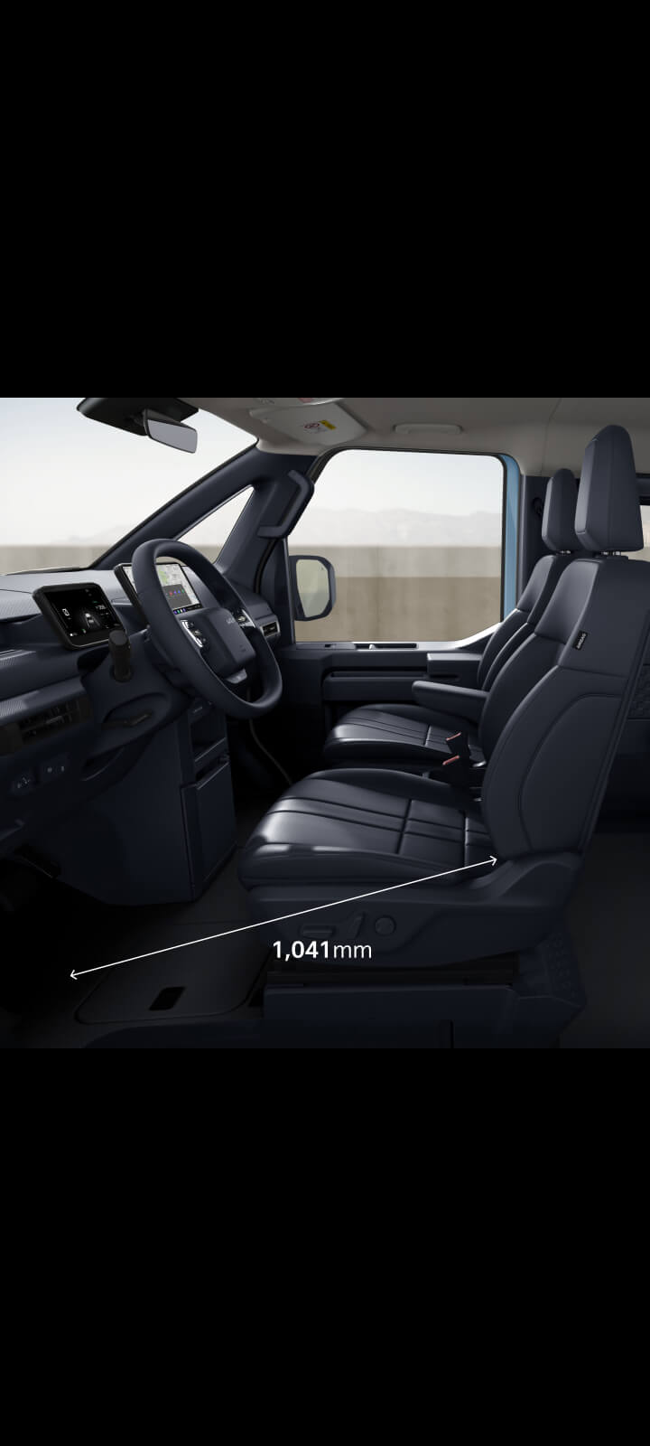 Side view of the Kia PV5 Passenger front cabin showing legroom in driver’s seat