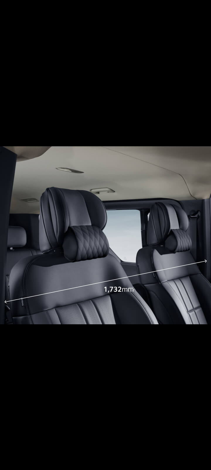 Close-up of the Kia PV5 Passenger front seats highlighting shoulder room