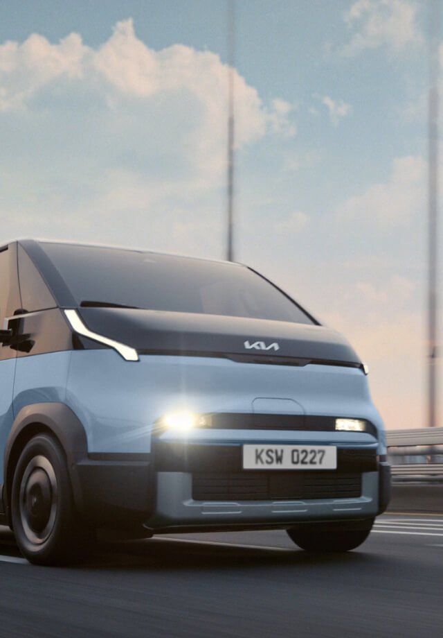 Top view of the Kia PV5 Passenger driving on highway