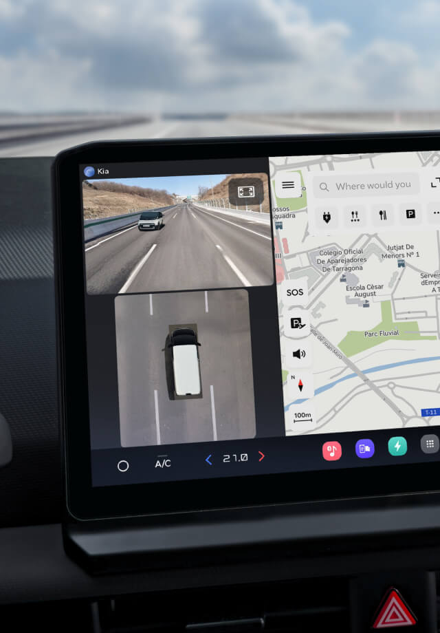 Close-up of infotainment screen showing navigation map and rear camera view