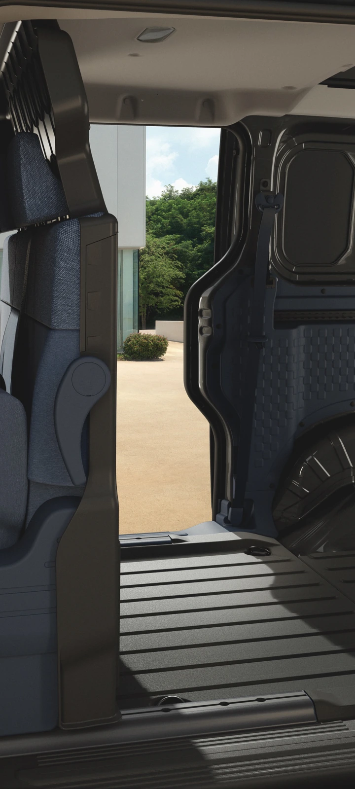 Intérieur du Kia PV5 Cabine Approfondie avec les sièges rabattus pour dégager l’espace de chargement