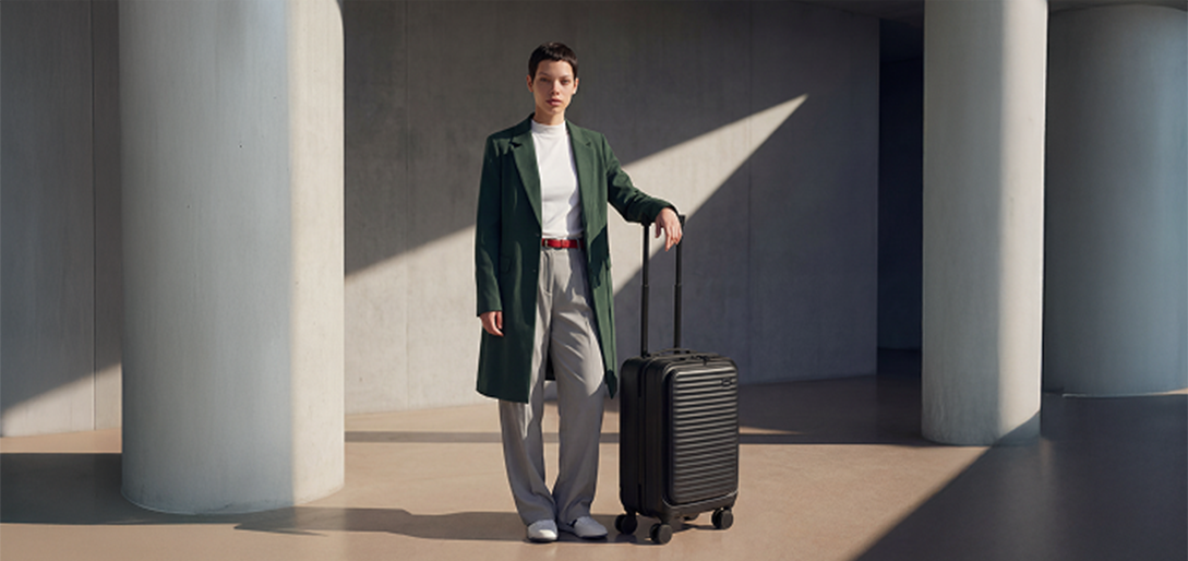 Woman with the Kia cabin luggage
