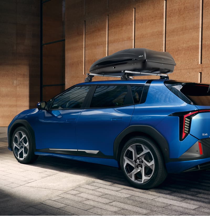 Kia EV4 equipped with the Kia Roof Rack as base for the Kia Roof Box.