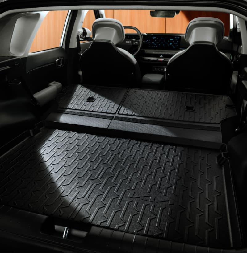 Kia Trunk Liner with Extension protecting the trunk area and the folded rear seats of a Kia vehicle.