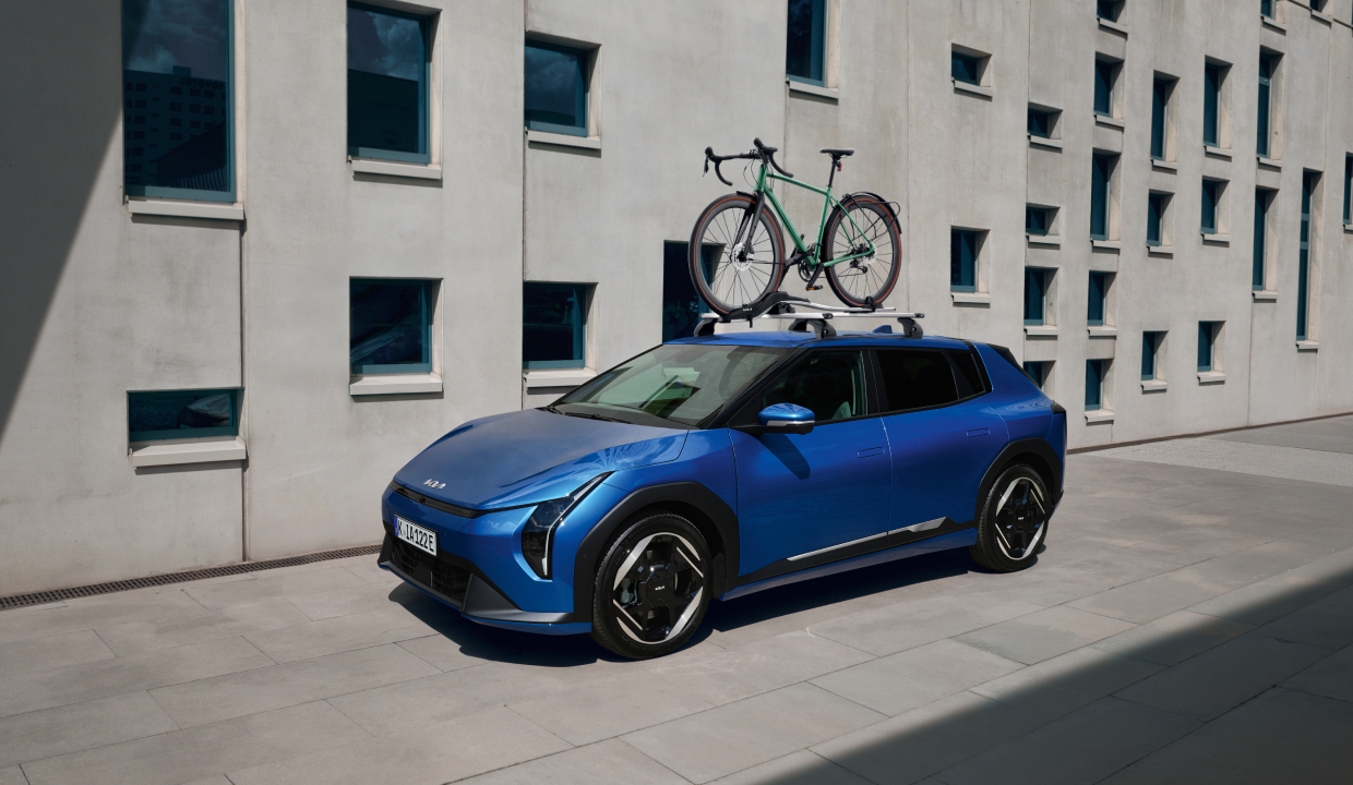 Kia EV4 equipped with the Kia Roof Rack and the Bike Carrier Plus.