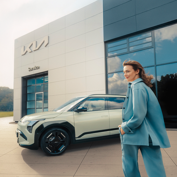 Customer picking up her freshly serviced Kia EV3 at her local Kia Dealer.